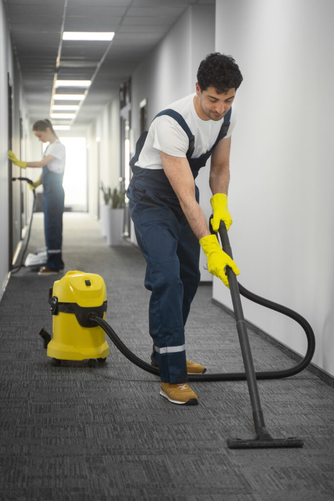cleaning a man mopping the floor